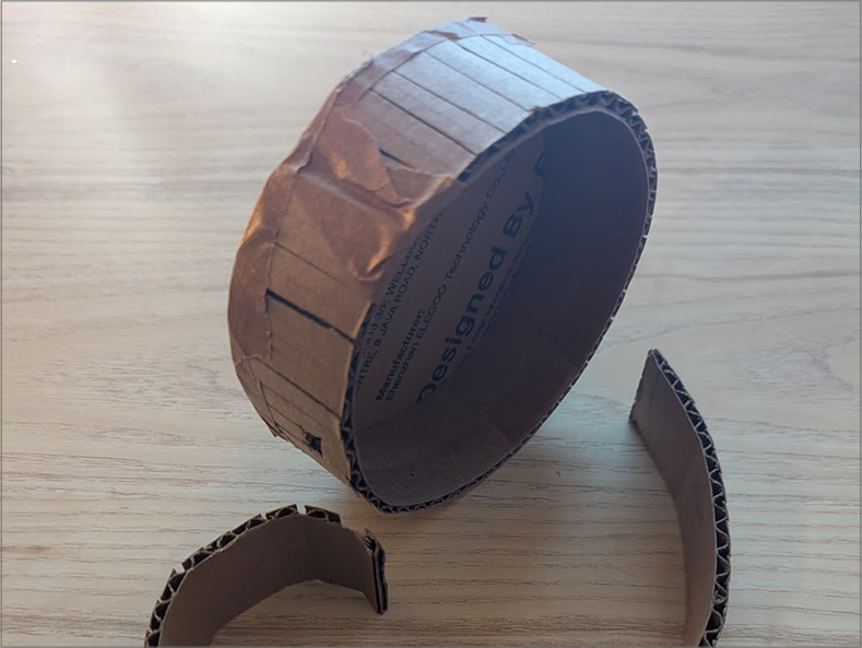 Photo of early experimentation. When prototyping, I learned various new skills related to how to manipulate the cardboard. My favorite that I was not expecing is the scoring of the cardboard to make it rounded. I was also fond of the cardboard tape, but unfortunately don't own any.